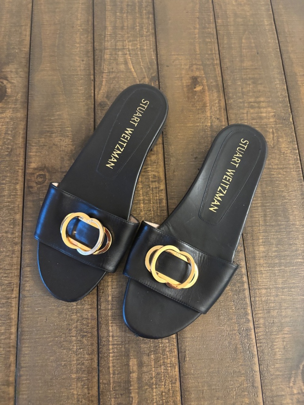 Stuart Weitzman Black Leather Slide Sandals with Gold Buckle Accent